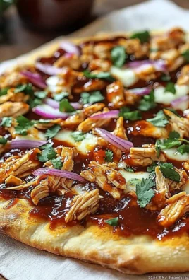 Delicious BBQ Chicken Flatbread Pizza topped with cheese and fresh ingredients