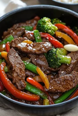 Delicious beef stir fry with fresh vegetables and savory sauce in a skillet