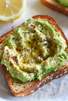 A beautifully plated best avocado toast topped with fresh ingredients and herbs