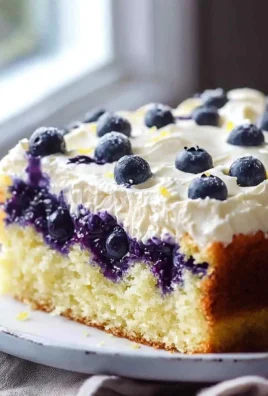 Delicious slice of best lemon blueberry cake with fresh blueberries