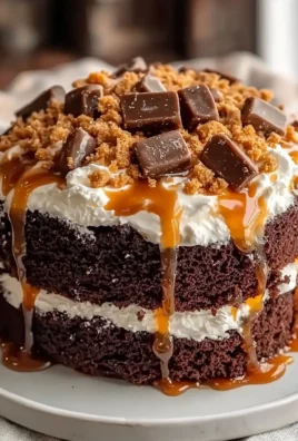 Delicious Better Than Sex Cake freshly baked and topped with chocolate and whipped cream.