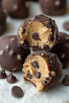 Delicious chocolate chip cookie dough truffles arranged on a plate.
