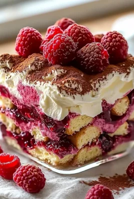 Delectable raspberry tiramisu dessert served in a glass