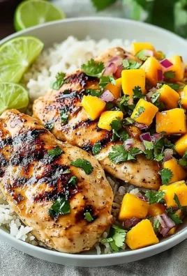 Delicious Honey Lime Chicken served with fresh Mango Salsa on a plate.