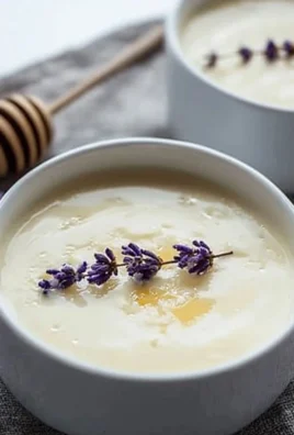 Delicious honey posset dessert served in a glass dish.