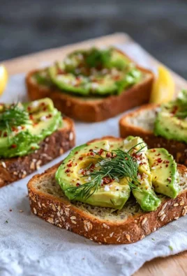 Delicious vegan avocado toast topped with cherry tomatoes and sesame seeds