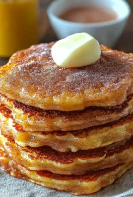 Delicious Spanish Churro Pancakes topped with chocolate sauce and cinnamon.