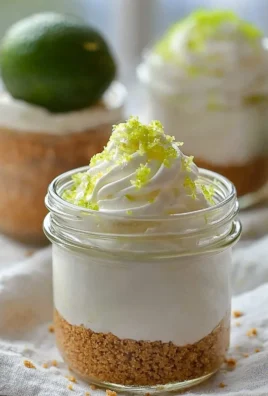 No-bake Key Lime Pie Mason Jar Desserts served with lime garnish