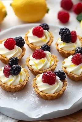 Mini no-bake lemon cheesecake tarts served on a decorative platter