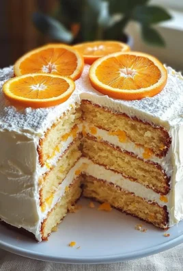Delicious Orange Creamsicle Cake with frosting and orange slices