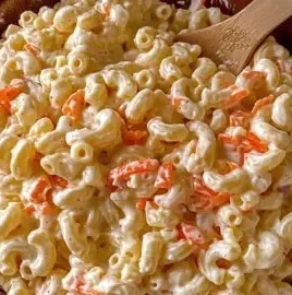 Bowl of authentic Hawaiian macaroni salad with creamy dressing and vegetables