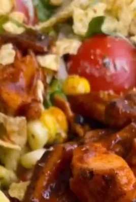BBQ Chicken Salad with black beans, fresh vegetables, and BBQ dressing.
