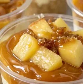 Delicious caramel apple dessert cups topped with caramel sauce and apple pieces