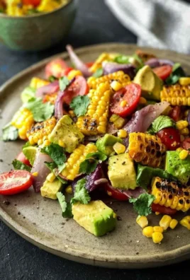 Charred Corn Avocado Salad with Roasted Red Onions in a bowl
