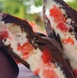 Chocolate coated strawberry yogurt bites, a delicious and healthy snack.
