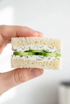Classic cucumber tea sandwiches on a platter, perfect for afternoon tea.