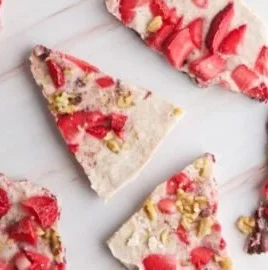 Frozen yogurt bark topped with berries and nuts for a healthy dessert