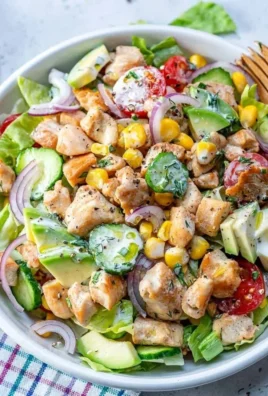 Bowl of healthy ranch chicken salad with fresh vegetables and grilled chicken
