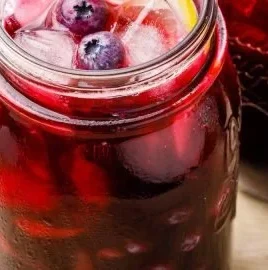 Homemade blueberry lemon iced tea made with fresh blueberries and black tea