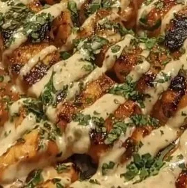 Honey Sriracha Chicken Rice Bowl with Creamy Lime Sauce on a plate