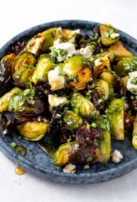 Hot Honey Brussels Sprouts drizzled with honey served in a bowl