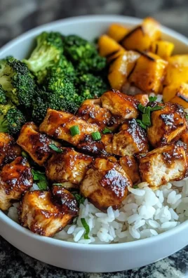 Delicious hot honey chicken bowls with vibrant vegetables and rice