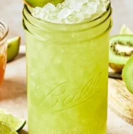 Glass of Kiwi Citrus Homemade Gatorade with fresh fruit garnish