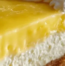 Slice of Lemon Supreme Pie with whipped cream on top