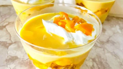Delicious Mango Trifle Cups with layers of mango, cream, and cake.