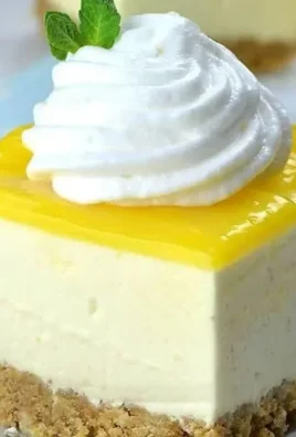 No Bake Lemon Cheesecake Bars with a creamy lemon topping and graham cracker crust.