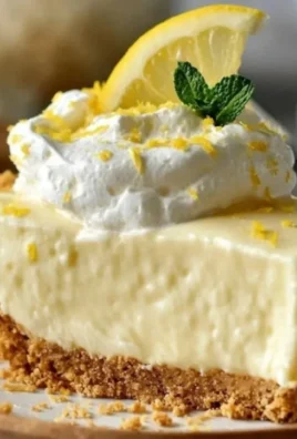 Delicious no-bake lemon icebox pie topped with whipped cream and lemon slices.