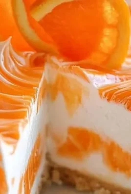 No-bake orange creamsicle cheesecake topped with orange slices.