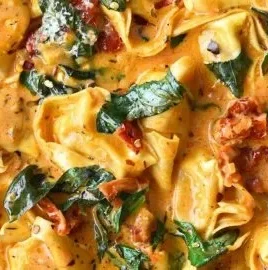 Creamy One-Pot Marry Me Tortellini served in a bowl with fresh herbs