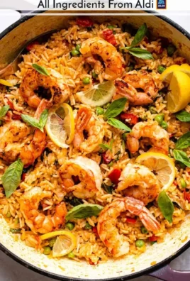 One-Pot Prawn and Rice dish served in a bowl with fresh herbs