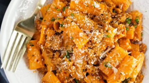 Delicious serving of spicy sausage rigatoni topped with herbs