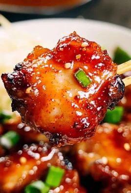 Delicious Sticky Sweet Chili Chicken served on a plate with garnish