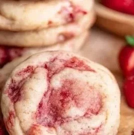Freshly baked strawberry cheesecake cookies on a plate