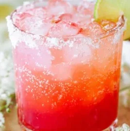 Strawberry Lime Mocktail Margarita served in a chilled glass with fresh fruit garnish.