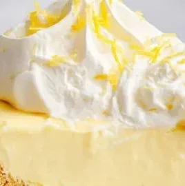 No-bake sunshine lemon cream pie topped with fresh lemons and whipped cream