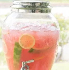 Glass of refreshing watermelon lemonade with mint garnish
