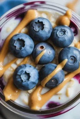 A bowl of blueberry overnight oats topped with fresh blueberries and almonds.