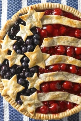 Homemade Cherry Blueberry Pie with fresh fruits on a rustic wooden table
