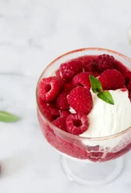 Homemade cottage cheese ice cream in a bowl topped with fresh berries