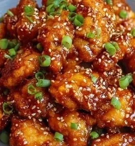 Delicious crispy sesame chicken dish garnished with sesame seeds