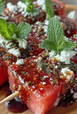 Fresh watermelon feta mint skewers drizzled with balsamic reduction