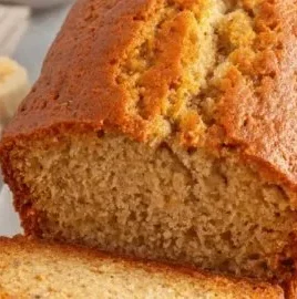 Delicious Greek Yogurt Banana Bread sliced on a wooden board