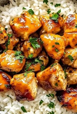 Delicious hot honey chicken bowls garnished with fresh vegetables.