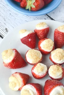 No Bake Strawberry Cheesecake Bites served on a plate with fresh strawberries