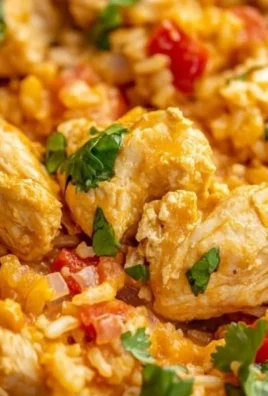 One Pot Queso Chicken and Rice dish served in a colorful plate.