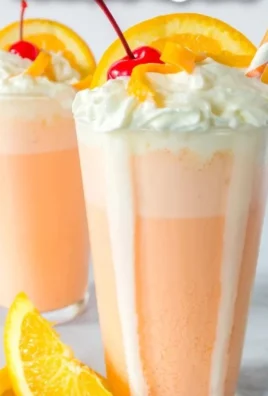 Delicious orange creamsicle milkshake topped with whipped cream